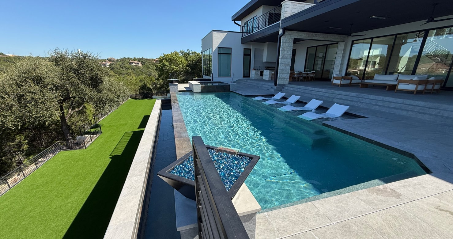 Luxurious backyard pool renovation in Austin, Texas, featuring modern design elements.